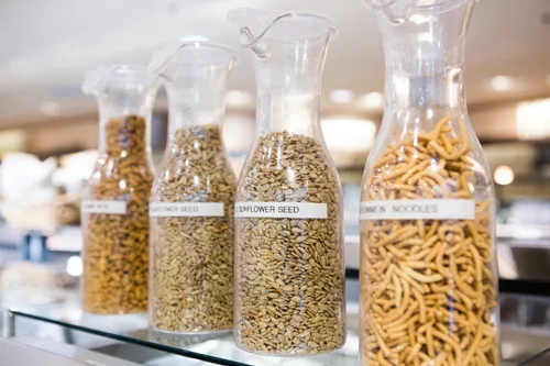 Clear containers of salad toppings